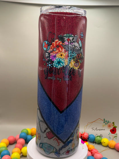 Back view of a red, blue, and silver nurse-themed glitter tumbler